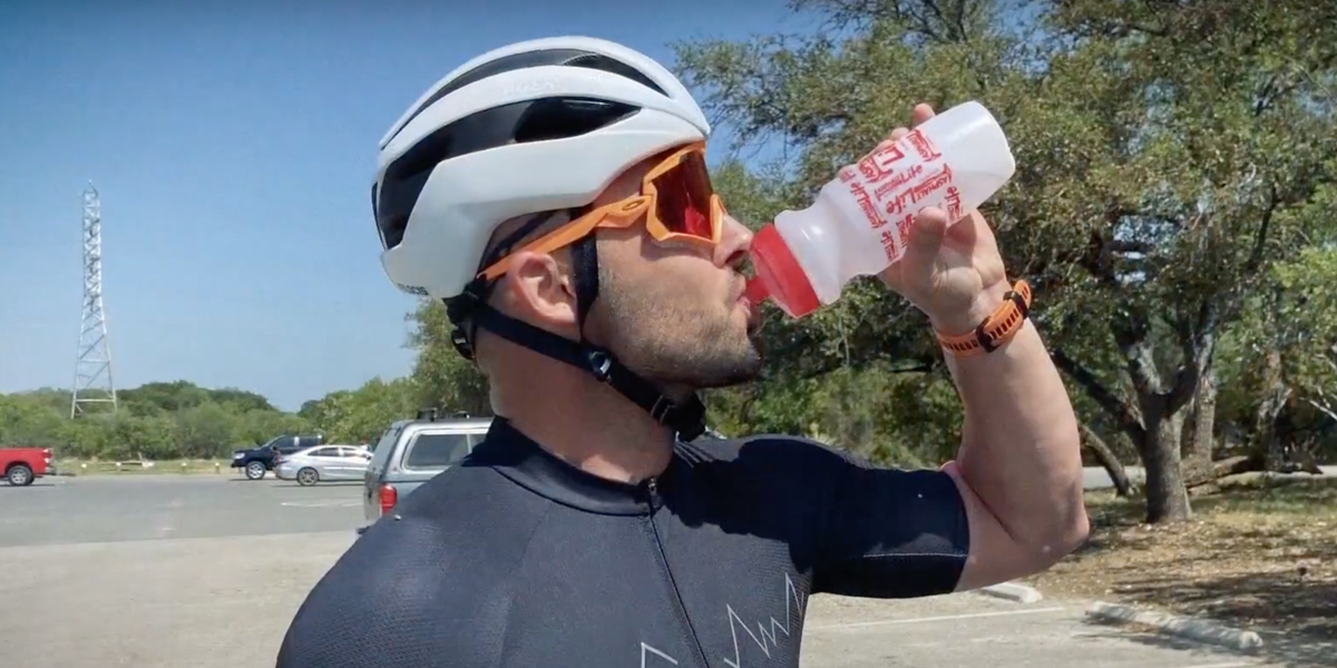 Sales Rep Brad Bellamy drinks from his Atlas water bottle after riding his bike in the hot Texas sun